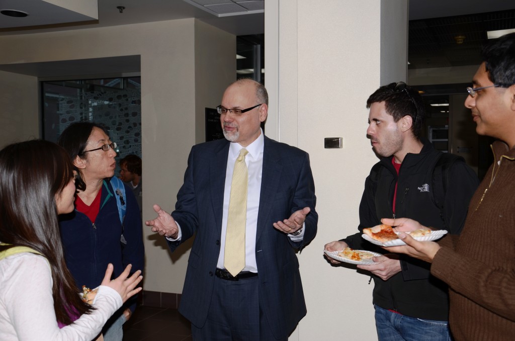 Perlmutter talks with some UW students.